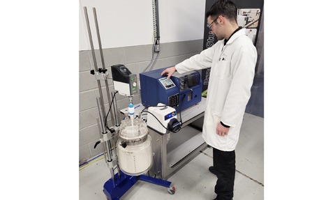 AMT clean room operation using a Coflore® flow reactor fed by an efficiently stirred vessel in a ReactoMate ATOM stand.